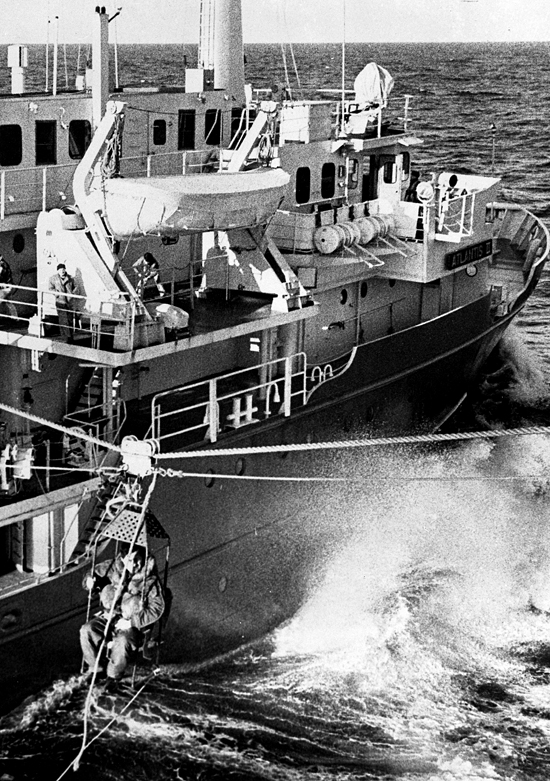 Fritz Hess transfers by highline from USS Hazelwood to Atlantis II during the Thresher search.
