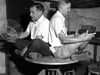 Henry Stommel, left, and Lou Howard (both on the MIT faculty at the time) hopped onto a turntable in the basement of Walsh Cottage to demonstrate the effect of rotation on seawater.