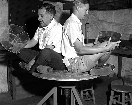 Henry Stommel, left, and Lou Howard (both on the MIT faculty at the time) hopped onto a turntable in the basement of Walsh Cottage to demonstrate the effect of rotation on seawater.