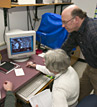 Enid Sichel Adjunct Scientist & Karl von Reden examine a nanotube foil with an atomic force microscope.