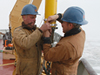 John Kemp and Kris Newhall assemble a mooring.