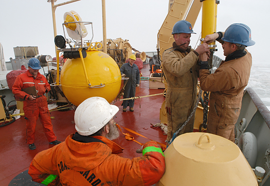John Kemp and Kris Newhall assemble a mooring.