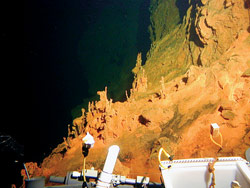 Reddish-orange iron oxide coats the seafloor on Loihi Seamount, an active underwater volcano 25 miles off the island of Hawaii.