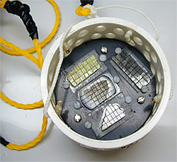 WHOI scientists prepared plastic buckets filled with thin, microbe-free samples of natural seafloor rock and placed them back on the seafloor.