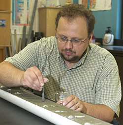 Giosan marks and prepares sediments from a split core for laboratory study.