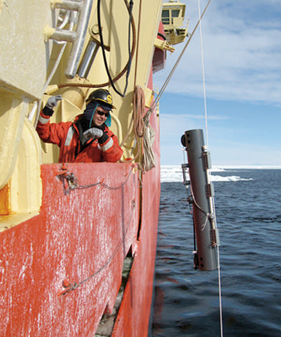 Working in open water in Antarctica's Ross Sea, Assistant Scientist Mak Saito deploys a water sampler from the R/V Nathaniel Palmer.