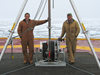 Kris Newhall and John Kemp on deck witht ITP deployment A-frame support.