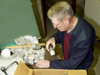 George LeRoy packs Mary Sears' Dana samples.