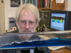 Scientist Tim Duda demonstrates with a wave tank what it is difficult to see in the ocean.