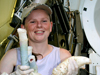 Rhiann Waller holding a bundle of tubeworms.