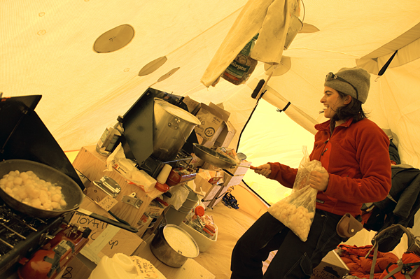 Andrea Burke cooking in the tent.