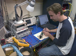 WHOI Engineer Keenan Ball tests a high-speed acoustic modem
