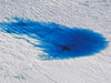 Supraglacial lakes may concentrate water so that it causes the ice to fracture and water to be injected directly to the bed, where the ice meets the ground. Added water would reduce friction between the ice and the ground, causing the ice sheet to flow faster to the ocean. 