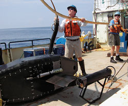 Dennis McGillicuddy helps prepare to lower the Video Plankton Recorder (VPR)