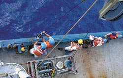 From left, researchers Jim Ledwell, Brian Guest, Blair Greenan, Penelope Howe, and Nathan Buck prepare to lower an
