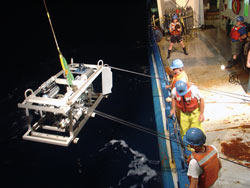 Researchers deploy a sampling sled to detect chemical tracers that helped them track how an eddy mixes water layers of the ocean.