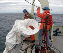deploying drifter in Bay of Fundy