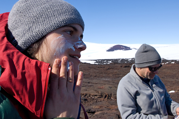Andrea Burke and Mark Kurz cover up with sunscreen.