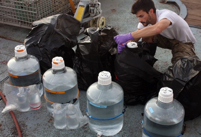 Jamie Becker preparing incubation bottles at sea in 2010