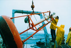 Jerry Dean fixing atmospheric instruments on buoy