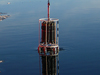 A conductivity/temperature/depth (CTD) rosette being lowered into the current.