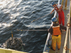 Joint Program student Christie Wood and Postdoctoral Investigator Alfredo Aretxabaleta prepare to recover the CTD rosette.