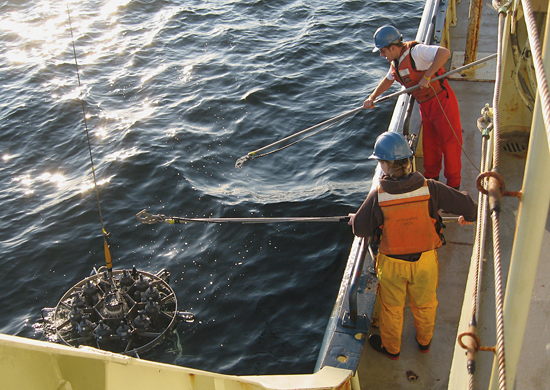 Joint Program student Christie Wood and Postdoctoral Investigator Alfredo Aretxabaleta prepare to recover the CTD rosette.