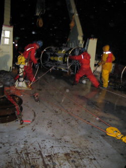 Getting the first of the two SALP frames into position. When both frames are perched at the stern's edge, the rew will hoist them over one by one. Four more hours and 2,250 more meters of mooring to go.