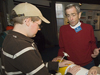WHOI volunteer Sheldon Holzer showing a student a REMUS vehicle at the WHOI exhibit center.