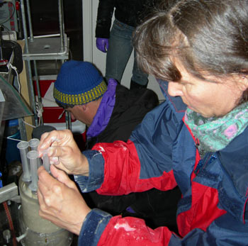 Joan Bernhard & Dan McCorkle working about the R/V Oceanus