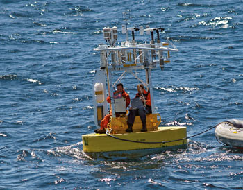 Frank Bahr & Jeff Lord work on replacing sensors on a buoy