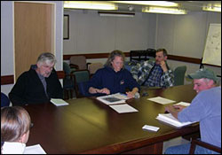 First 
                        science meeting in the board room. From left: Doug Seiberg 
                        (IOS), Sarah Zimmermann (IOS), Waldeck Walczowski (IOS), 
                        and John Kemp (WHOI).