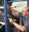 Karl von Reden Staff Physicist loads samples.