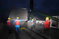 The biology teamÃÂÃÂ(left to right) Jun Nishikawa, Hiroomi Miyamoto, Jennifer George, and Hannes BaumannÃÂÃÂwith technicians Justin Smith and Paul Balch haul in the Methot net.