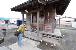 Ken Buesseler pays his respects in front of Namiwake Jinja. The shrine was originally built on land that was spared during the Jogan tsunami of 869 A.D. Namiwake roughly translates as Âsplit wave.Â