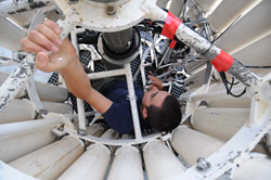 Justin Smith gives the instruments on the rosette sampler a thorough inspection.