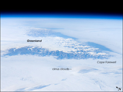View of Cape Farewell from space, taken by astronauts on the international space station. The ice cap, some 3,000 meters high, is surrounded by rugged mountains cut by many fjords. 