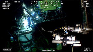 screen grab showing ROV moving IGT sampler toward jet of oil & gas