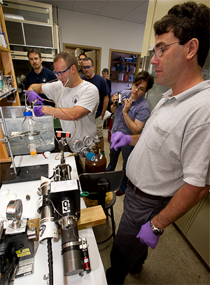 Sean Sylva prepares to withdraw sample of Deepwater Horizon oil and gas from IGT sampler