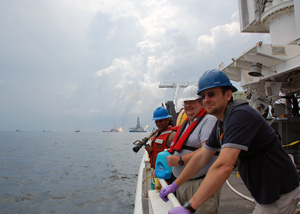 Ben Van Mooy and others on ship near the burning Deepwater Horizon oil rig 