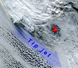A storm (whose center is denoted by the red letter L) passes by Cape Farewell, initiating an occurrence of the Greenland tip jet, as indicated by the cloud streaks. This true color image was taken by a NOAA satellite on January 24, 2001.