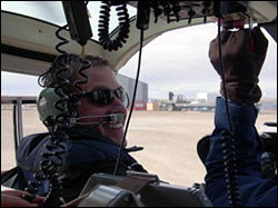 Kris Newhall enjoying                          his first helicopter ride.