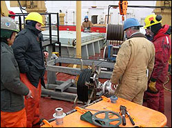 Using a specially designed dual capstan winch to reel in over 3000 m of mooring wire rope cable.