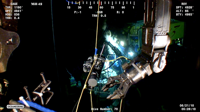 screen grab showing ROV arm and IGT sampler at Deepwater Horizon wellhead