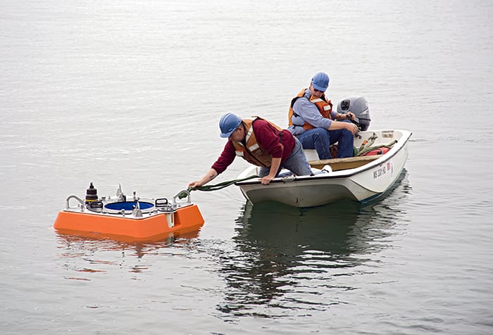 Two Men, a Boat, and a Float