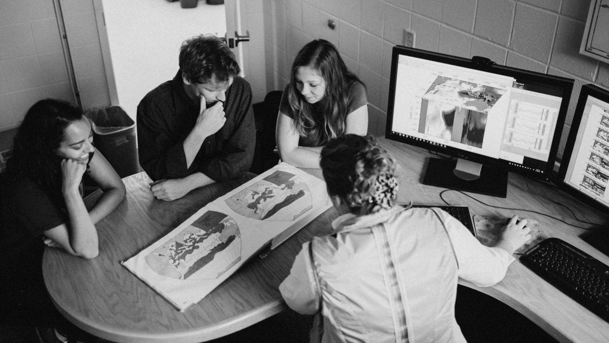 Climate group discussion. Postdoc and students discuss their climate research with Associate Scientist Caroline Ummenhofer (front)