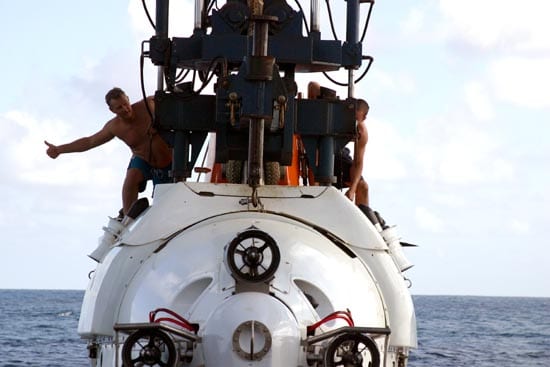 Support swimmers Carl Wood and Anthony Berry signal crew members aboard R/V Atlantis during an Alvin launch (Amy Nevala)