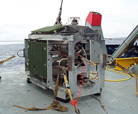 Medea, Jason's partner vehicle. Medea hangs from the research ship, attached by a steel cable (top) with the fiberoptic data tether encased inside. As the ship rolls in surface waves, the cable pulls on Medea but leaves Jason free to explore. (photo by Woods Hole Oceanographic Institution)