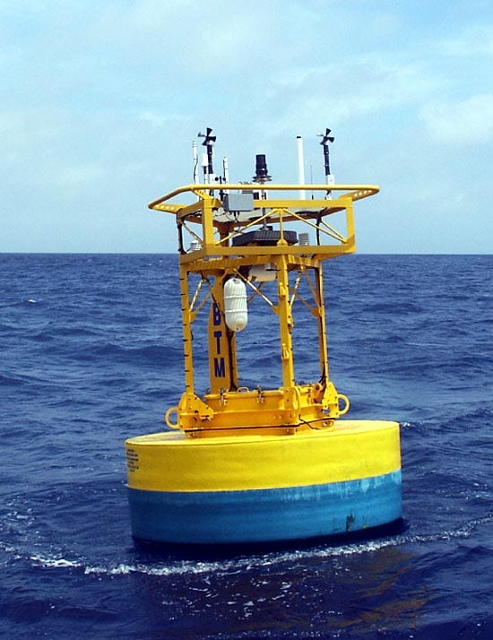 Aluminum buoys are prone to leaks after long periods at sea. Most newer buoys, like this one off Bermuda, are made of solid Surlyn foam that is much more durable and buoyant. The tower top has been further enlarged from earlier designs, and the square tower provides more headroom for engineers reaching into the buoy well. (Photo courtesy Bob Weller, WHOI)