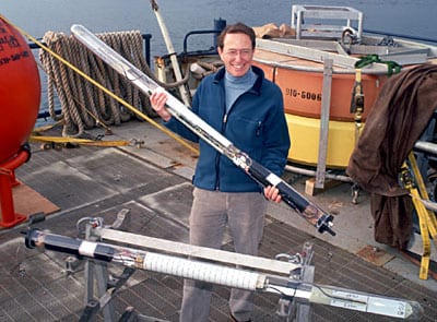 Philip Richardson, a scientist emeritus at the Woods Hole Oceanographic Institution, prepares a RAFOS float to use at sea. (Woods Hole Oceanographic Institution)